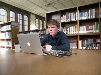 Man studying with computer in East Asia reading room