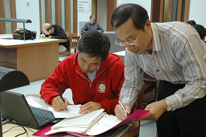 Two Men Studying