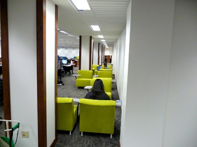 Foster Library Studying in Green Chairs