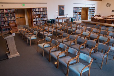 View of the Donald E. Petersen Room, located on the 4th floor of the Allen Library, looking NE towards round window and conference table.