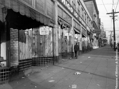 Jackson Street block showing vacant stores after evacuation, PI-28068